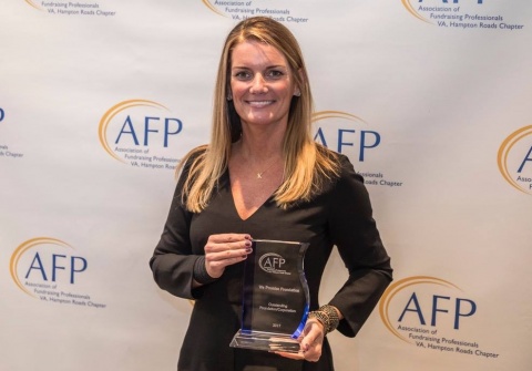 Karen Lane, executive director of the We Promise Foundation accepts the Outstanding Foundation Award from the Hampton Roads Fundraising Professionals during its 2017 award program on November 9, 2017