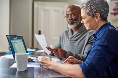 Middle-aged couple on the computer