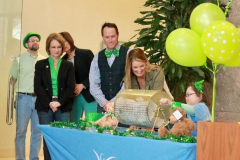 Watching the raffle drawing at the Chartway / We Promise Foundation St Patrick's Day event