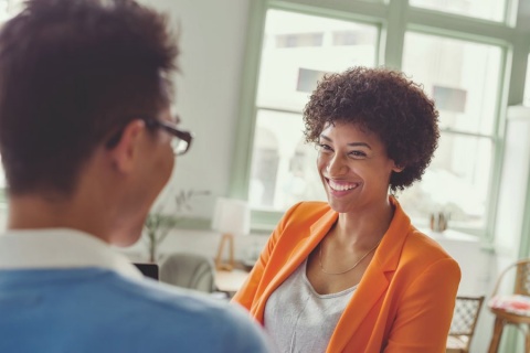 smiling man and woman in conversation