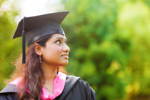 young woman in cap and gown