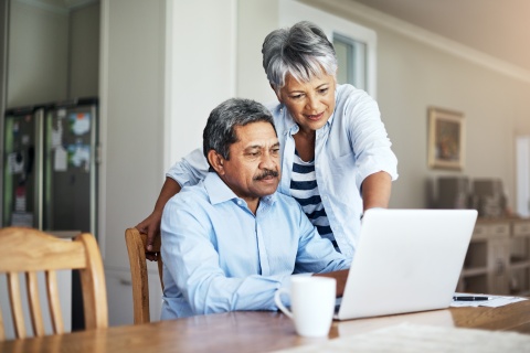 Hispanic couple on laptop computer
