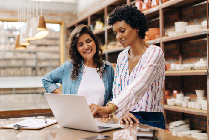 Happy young businesswomen running a creative small business together.