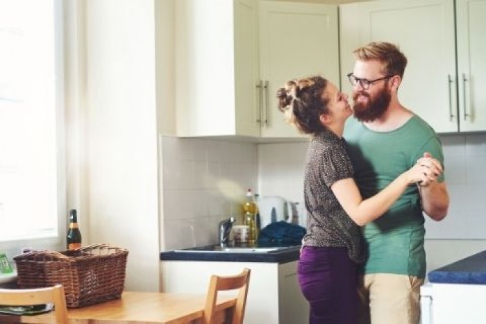 couple dancing in kitchen