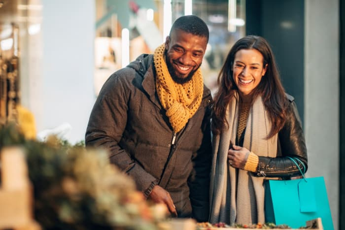 a woman and man shopping together
