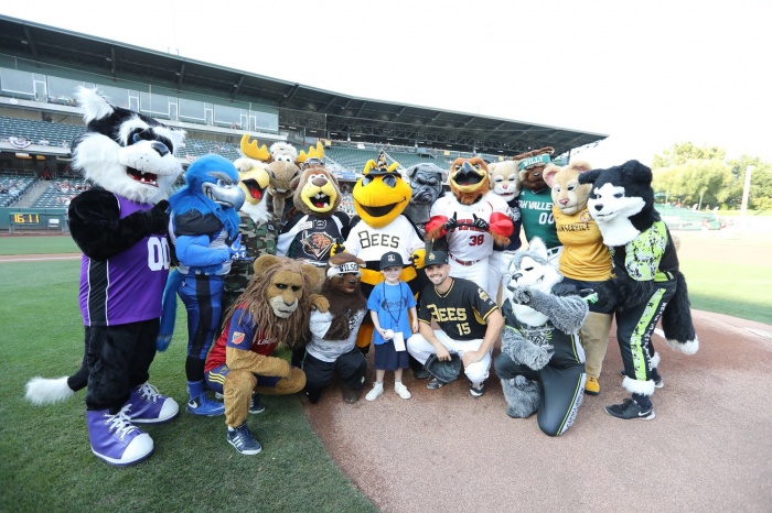 Group of mascots Make A Wish kid and baseball player