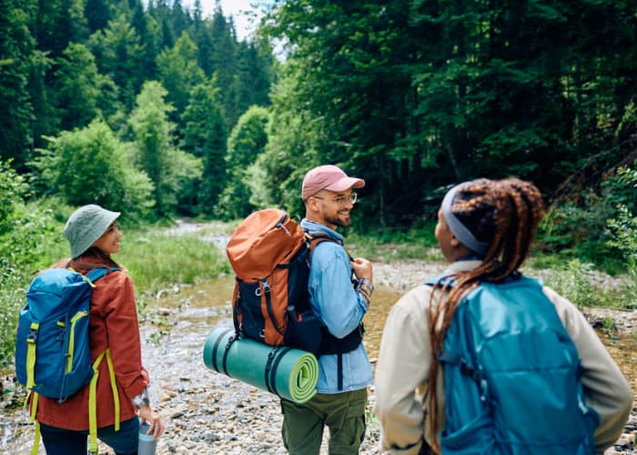 a group of friends hiking through a mountain together
