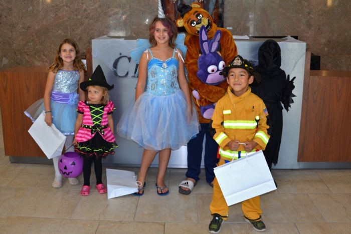 We Promise heroes and their siblings at Chartway’s headquarters in Virginia Beach to trick-or-treat.