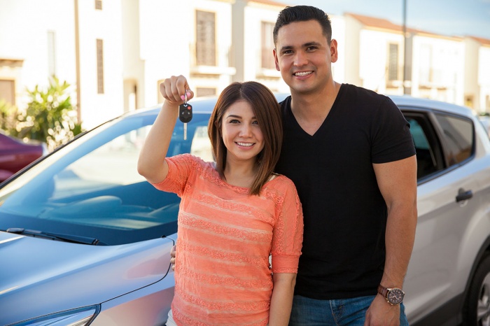 Couple buying a new car