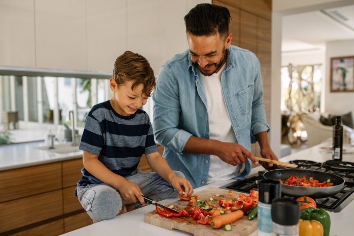 Father and son prepping food