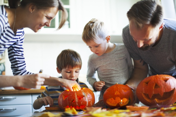 Family carving pumpkins