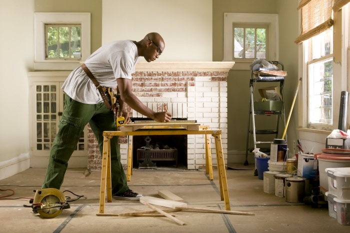 African American Male Fixing His Home
