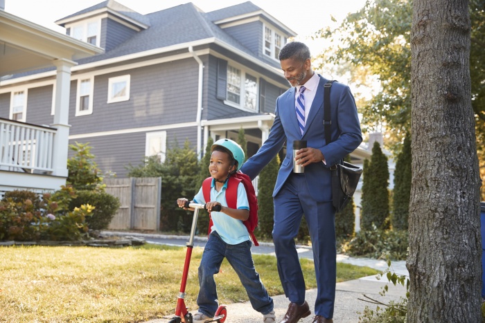 African American Man walking with his son