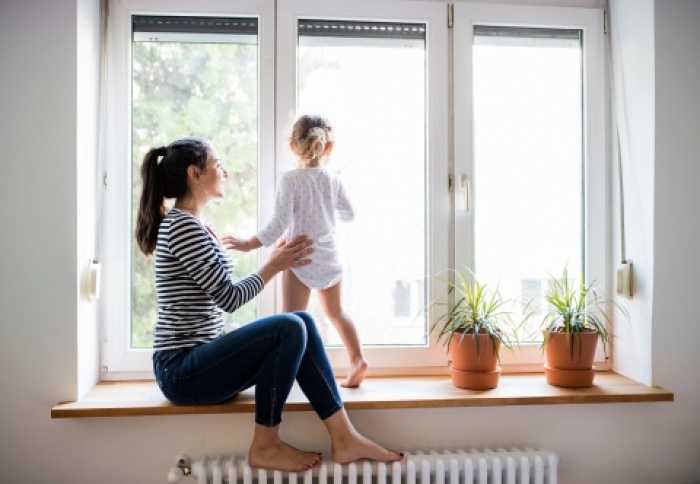 mother with kid in window