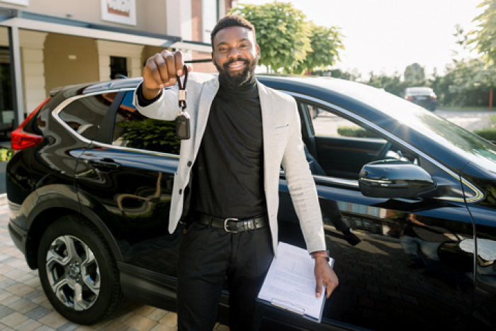 young man car shopping after getting auto loan pre-approval