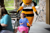 Brinley buzzing about the Putting For Promises Golf Tournament with Utah Bees mascot Bumble the Bee