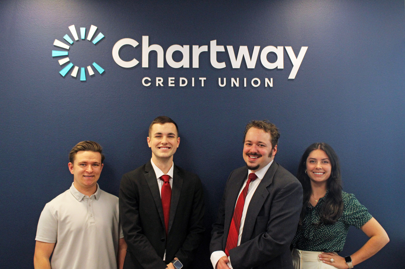 Chartway interns in front of the Chartway Credit Union sign